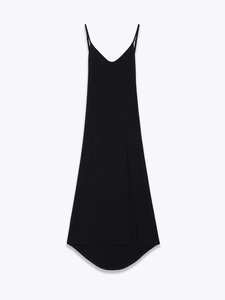 Detail of black long slip dress with thin straps, high slit and soft drape fabric