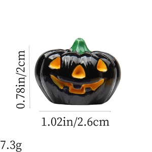 Detail view of small black resin Halloween pumpkin charm with dimensions and 7.3g weight