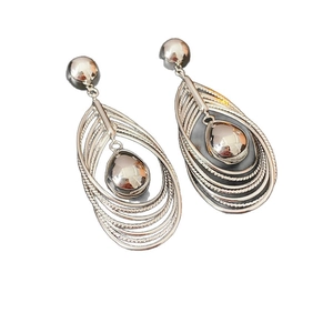 Silver hollow teardrop tassel drop earrings with nested circles and metallic finish