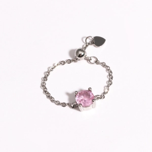 Detailed view of silver adjustable chain ring with pink gemstone and heart slider