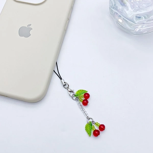 Handmade cherry glass bead phone charm with red fruit beads and green leaf on black strap
