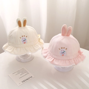 Pink and beige knitted baby sun hats with rabbit ears, embroidery and lace edges