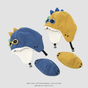 Detail of kids winter pilot hat with lamb wool lining and cartoon dinosaur fins