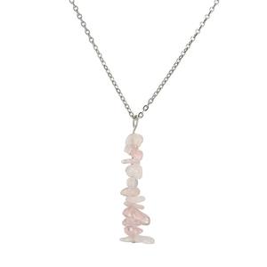 Detailed shot of handmade silver chain necklace featuring irregular pink quartz stone pendant