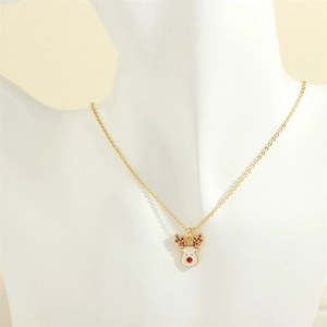 Detail of Christmas reindeer necklace with white enamel and red stone inlay on neck model