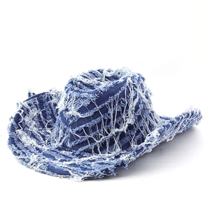 Western denim sun hat with distressed fringe edges and heavy frayed bohemian style
