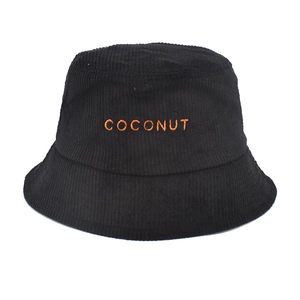 Close-up of black corduroy bucket hat with orange COCONUT embroidery and retro texture
