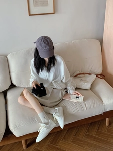 Cozy home setting showing embroidered puppy socks paired with a casual outfit on a sofa