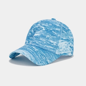 Detail of blue and white marble print on a six-panel curved brim baseball cap