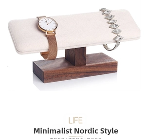 Macro detail of wooden bracelet holder with beige microfiber bar for jewelry display