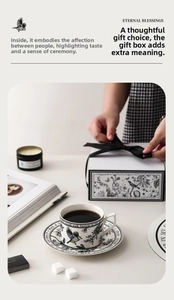 Detailed view of vintage ceramic coffee cup and saucer set in an elegant gift box