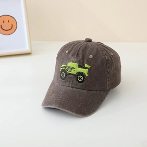 Close-up of a brown kids baseball cap featuring green off-road vehicle embroidery detail