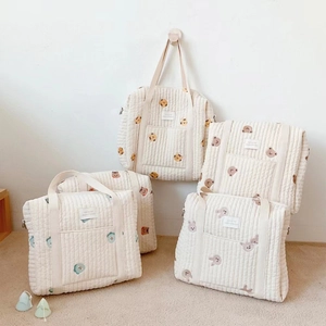 Quilted cotton diaper bags with cartoon animal embroidery and spacious front pockets