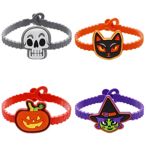 Set of four adjustable Halloween silicone bracelets with cartoon pumpkin and ghost motifs