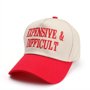 Close-up of red letter embroidery on a high-crown five-panel trucker baseball cap