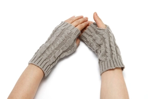 Close-up of taupe cable-knit texture on warm fingerless gloves with ribbed cuffs