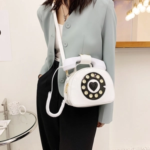 Unique white vintage telephone shaped crossbody bag with creative dial detail and handle