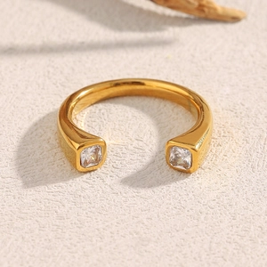Macro shot of 18K gold plated open ring featuring two square cubic zirconia stones