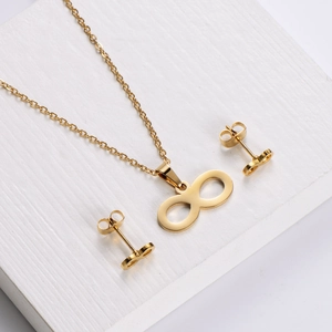 Minimalist gold infinity jewelry set featuring a delicate necklace and matching earrings