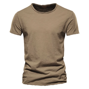 Close-up of earth brown slub cotton fabric texture on a slim fit men's T-shirt