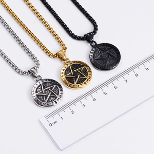 Three-color Viking pentagram rune pendants in silver, gold, and black with scale reference