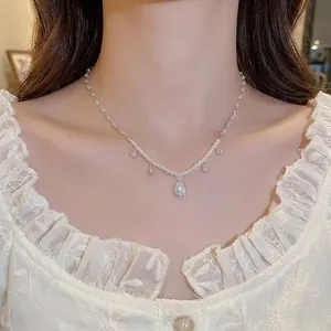 Elegant pearl choker necklace with flower zircon pendants for women shown on neck