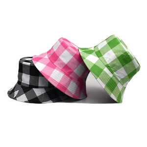 Plaid pattern reversible bucket hat in black, pink, and green checkerboard colors