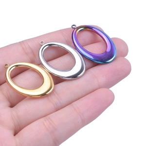 Oval hollow titanium steel pendants in gold, silver and iridescent finish for DIY jewelry