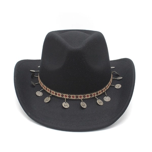 Detailed view of black cowboy hat featuring ethnic patterned band and metal disc charms