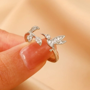 Elegant hummingbird silver open ring featuring leaves and sparkling zircon stones