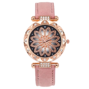 Detail of rose gold ladies' watch featuring a floral dial with crystal accents and pink strap