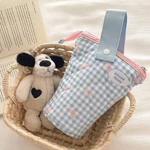 Blue checkered quilted organizer bag with pink zipper and plush puppy keychain detail