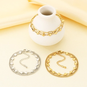 Detail of adjustable double-layer heart charms chains in gold and silver finish