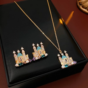 Elegant gold castle jewelry set featuring necklace and earrings with multicolor gemstones