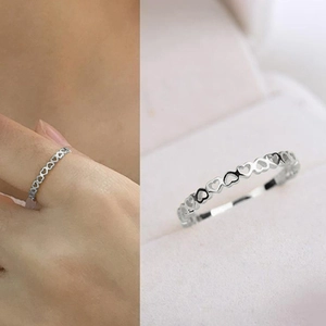 Minimalist silver-tone hollow heart-shaped open ring for women on finger and still life view