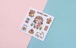 Detail of cute Korean PVC stickers with cartoon girl, cat, and sweets on a bicolor background