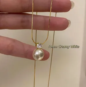 Elegant 10mm creamy white pearl necklace with zircon pendant on golden steel chain