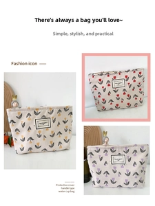Close-up of floral corduroy cosmetic bag with tulip pattern and side handle