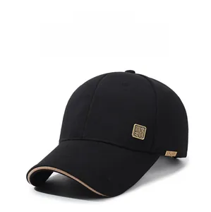 Detail of black baseball cap featuring a golden China seal emblem and SPORT metal plate
