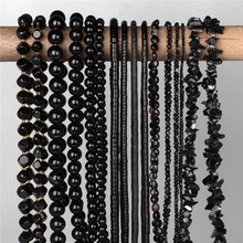 Detailed display of assorted black obsidian gemstone beads in various cuts and sizes