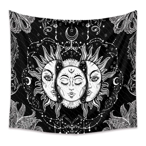 Detail of bohemian sun and moon tapestry with celestial stars and mystic botanical patterns