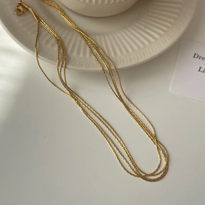 French style multi-layered gold titanium steel necklace with fine wire strands