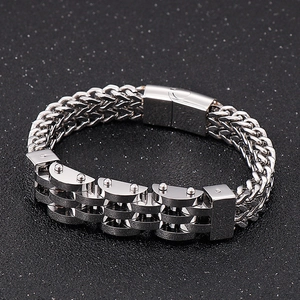 Close-up of silver titanium steel industrial double-row link bracelet with high-gloss finish