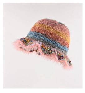 Close-up of rainbow knit bucket hat with pink faux fur trim and textured patterns