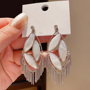 Silver vintage hollow oval earrings with long tassel fringe and white shell inlay detail