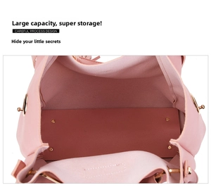 Detail view of pink tote interior with spacious capacity and gold protective metal feet