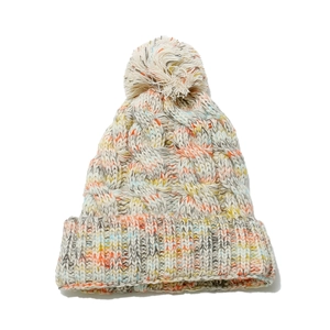 Colorful chunky knit beanie with pompom for winter outdoors and skiing warmth