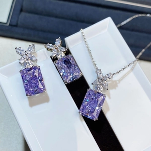 Macro shot of S925 silver jewelry set featuring radiant-cut purple stones and floral details