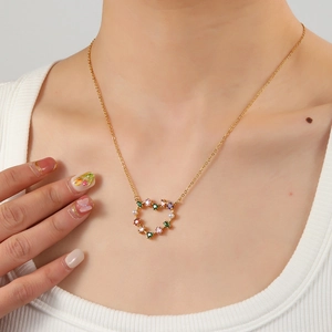 18K gold plated heart necklace with colorful zircons and pearls on model neck