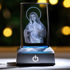 Detailed view of 3D laser engraved Virgin Mary crystal cube on a black LED light base